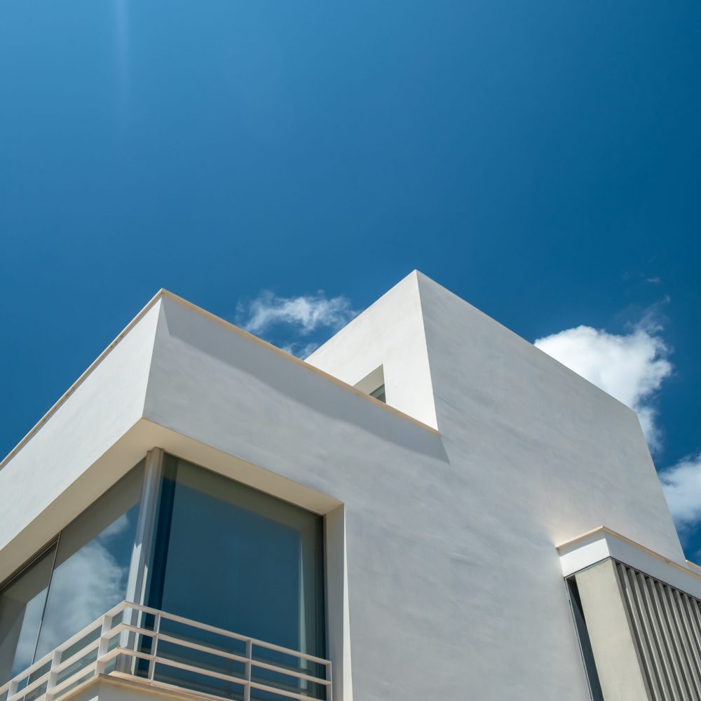 Modern Luxury Villa Against A Bright Blue Sky With Copy Space